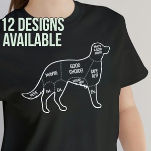 May include: Black t-shirt with a white graphic of a dog. The dog is divided into sections with labels like "Good Choice!" and "Safe Bet!" The text "12 Designs Available" is at the top of the shirt.