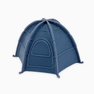 May include: A small, navy blue tent with a rounded top and a single arched window. The tent has a simple design with visible support beams and is set against a plain white background. The tent is a miniature model.