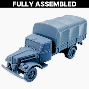 Ford V3000 (w okładce), w pełni zmontowana miniatura: niemiecki model ciężarówki wojskowej z II wojny światowej