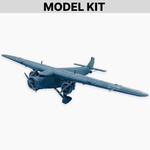 May include: A blue model airplane kit with the text "MODEL KIT" at the top. The model features two propellers, wings, and a tail. The airplane is a detailed replica of a vintage aircraft.
