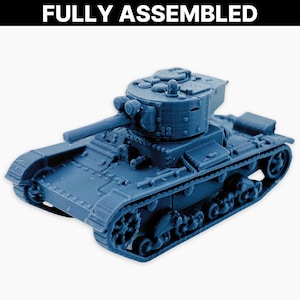 May include: A blue model tank, fully assembled, with a detailed design. The tank features a turret, cannon, and treads. The text "FULLY ASSEMBLED" is displayed above the tank.