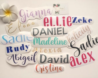 May include: A collection of personalized name stickers in various colors and fonts, including names like Sadie, Ellie, Gianna, and Alex.