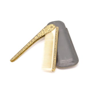 Petit peigne pliable vintage avec son étui en cuir