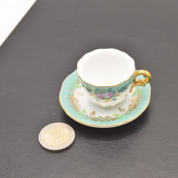 Pretty little porcelain cup with its saucer