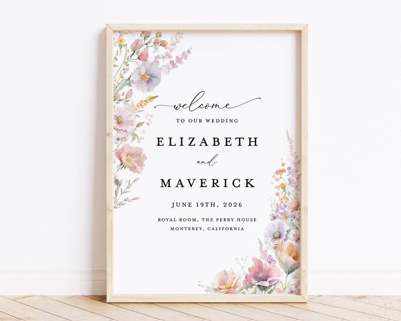 May include: A wedding announcement sign with a floral border. The sign reads "Welcome to our wedding, Elizabeth and Maverick, June 19th, 2026, Royal Room, The Perry House, Monterey, California."