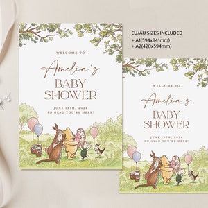 Puede incluir: Una invitaci&oacute;n a un baby shower con tem&aacute;tica de Winnie the Pooh con una ilustraci&oacute;n de acuarela de Winnie the Pooh, Piglet, Eeyore, Tigger y Owl. La invitaci&oacute;n es para el baby shower de Amelia el 19 de junio de 2026. El texto dice "Bienvenido al baby shower de Amelia, 19 de junio de 2026, &iexcl;Encantados de que est&eacute;s aqu&iacute;!"