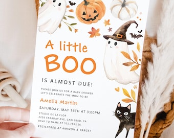 May include: A baby shower invitation with a Halloween theme. The invitation features illustrations of ghosts, pumpkins, and a black cat. The text reads "A little BOO is almost due!" and includes event details.
