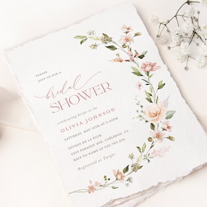 May include: A floral bridal shower invitation with a pink and green watercolor design. The invitation includes the text "PLEASE JOIN US FOR A bridal SHOWER celebrating bride-to-be OLIVIA JOHNSON SATURDAY, MAY 16TH AT 3:00PM STUDIO DE LA FLOR 2205 FARADAY AVE, CARLSBAD, CA RSVP TO NAME AT 532.783.226 Registered at Target"