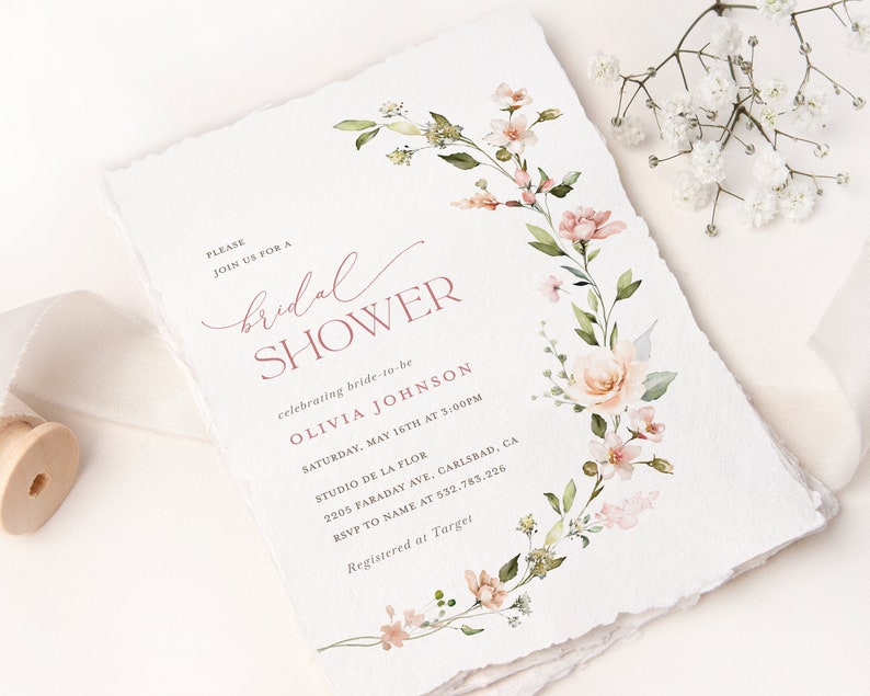 May include: A floral bridal shower invitation with a pink and green watercolor design. The invitation includes the text "PLEASE JOIN US FOR A bridal SHOWER celebrating bride-to-be OLIVIA JOHNSON SATURDAY, MAY 16TH AT 3:00PM STUDIO DE LA FLOR 2205 FARADAY AVE, CARLSBAD, CA RSVP TO NAME AT 532.783.226 Registered at Target"
