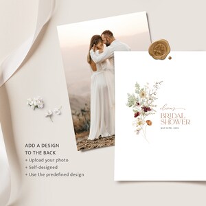May include: A white card with a floral design and the text "Olivia's Bridal Shower" in brown lettering. The date is written below the text. The card is on a white background.