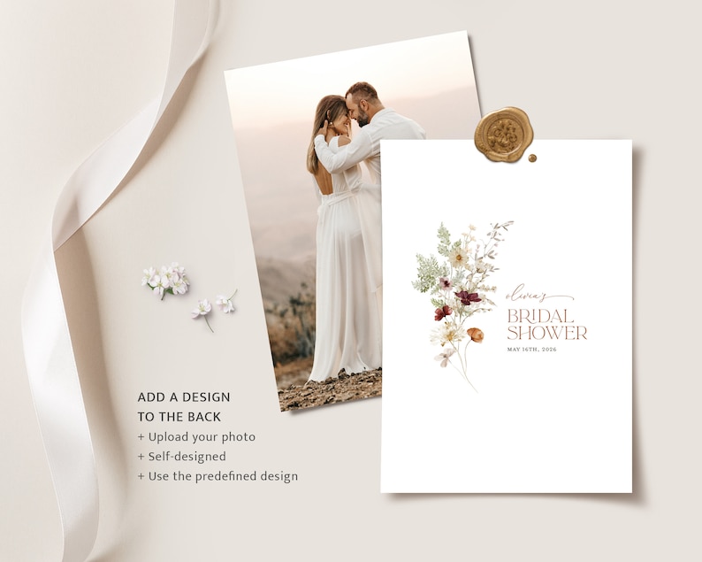 May include: A white card with a floral design and the text "Olivia's Bridal Shower" in brown lettering. The date is written below the text. The card is on a white background.