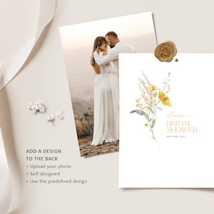 May include: A white card with a watercolor illustration of yellow flowers and green leaves. The text "lioraz BRIDAL SHOWER MAY 14TH, 20" is printed in gold lettering.