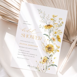 May include: A white bridal shower invitation with a watercolor illustration of yellow flowers and green leaves. The text reads "Please join us for a bridal shower celebrating bride-to-be Olivia Johnson Saturday, May 16th at 5:00PM Studio de la Flor 2205 Faraday Ave, Carlsbad, CA RSVP to name at 532.783.226 Registered at Target"