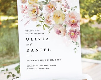 Peut inclure: Panneau de bienvenue de mariage blanc sur un chevalet, orné d'art floral à l'aquarelle dans les tons de rose, jaune et vert. Le panneau indique "BIENVENUE AU MARIAGE DE OLIVIA et DANIEL" avec la date et le lieu.