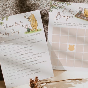 May include: Two printable baby shower game cards featuring Winnie the Pooh and Piglet. The first card is a "Name That Baby Song" game with a list of songs that include the word "baby". The second card is a "Baby Bingo" game with a grid of squares to be filled with gifts the mother-to-be will receive.