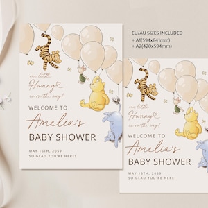 Pode incluir: Dois cartazes de ch&aacute; de beb&eacute; com personagens do Ursinho Pooh e bal&otilde;es. Os cartazes dizem "Bem-vindo ao ch&aacute; de beb&eacute; de Amelia" com a data de 16 de maio de 2059. Os cartazes incluem tamanhos EU/AU A1 (59,4 cm x 84,1 cm) e A2 (42 cm x 59,4 cm).