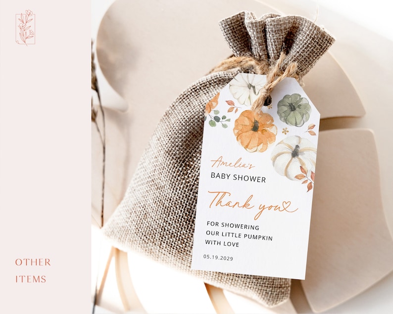 May include: A white thank you tag with watercolor illustrations of pumpkins and fall leaves. The tag says "Amelia's Baby Shower Thank you" and includes the date "05.19.2029".