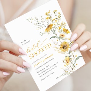 May include: A white bridal shower invitation with a gold floral design. The invitation includes the text "PLEASE JOIN US FOR A bridal SHOWER celebrating bride-to-be OLIVIA JOHNSON SATURDAY, MAY 16TH AT 3:00PM STUDIO DE LA FLOR 2005 FARADAY AVE, CARLSBAD, CA RSVP TO NAME AT 532.783.226 Registered at Target"