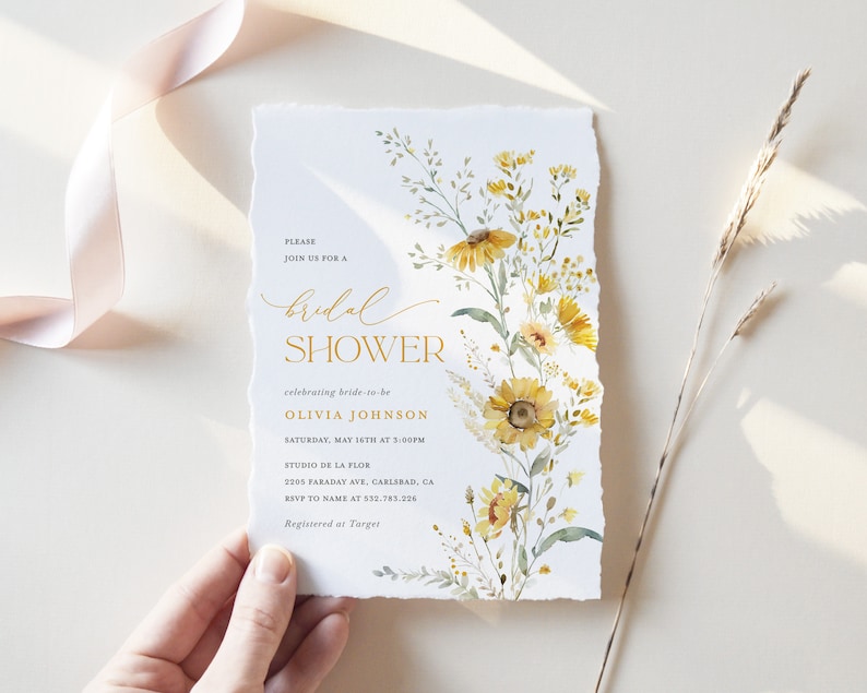 May include: A yellow and green floral bridal shower invitation with the text "PLEASE JOIN US FOR A bridal SHOWER celebrating bride-to-be OLIVIA JOHNSON SATURDAY, MAY 16TH AT 3:00PM STUDIO DE LA FLOR 2205 FARADAY AVE, GARLSBAD, CA RSVP TO NAME AT 532.783.226 Registered at Target"