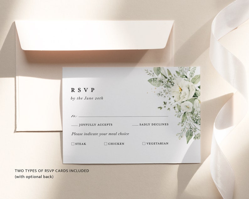 May include: White RSVP card with a floral design in the top right corner. The card has the text "RSVP by the June 20th" and includes options for guests to indicate if they will be joyfully accepting, sadly declining, or their meal choice: steak, chicken, or vegetarian.