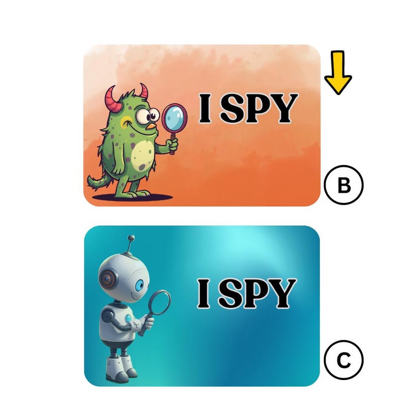 May include: Two illustrated cards with the text "I SPY". One card shows a green monster with a magnifying glass on an orange background. The other card features a robot with a magnifying glass on a blue background.
