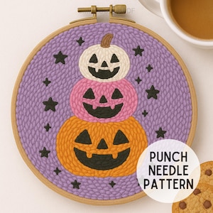 May include: A Halloween punch needle design showing three pumpkins, orange, pink, and white, stacked with carved faces, set against a purple background with black star accents, framed in a wooden hoop. The text "PUNCH NEEDLE PATTERN" is visible.