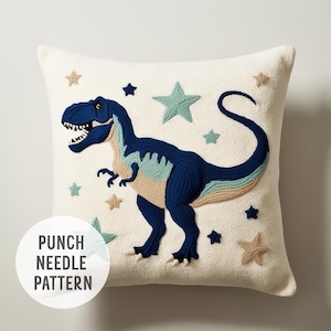 May include: White pillow with a blue and green embroidered dinosaur and stars. "Punch Needle Pattern" is written in the bottom left corner.