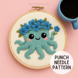 May include: A teal octopus punch needle pattern in a wooden embroidery hoop. The octopus has a blue flower crown and pink cheeks. The text "PUNCH NEEDLE PATTERN" is in a white circle. A blue mug is in the background.