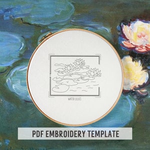 May include: A black and white line drawing of water lilies on a white background in a wooden embroidery hoop. The text "Water Lilies" is below the drawing. The hoop is on a blue and green background with a painting of water lilies.