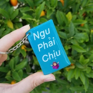 Ngu Phai Chiu 2-inch Keychain | Vietnamese Phrase Charm | Funny Vietnamese Saying