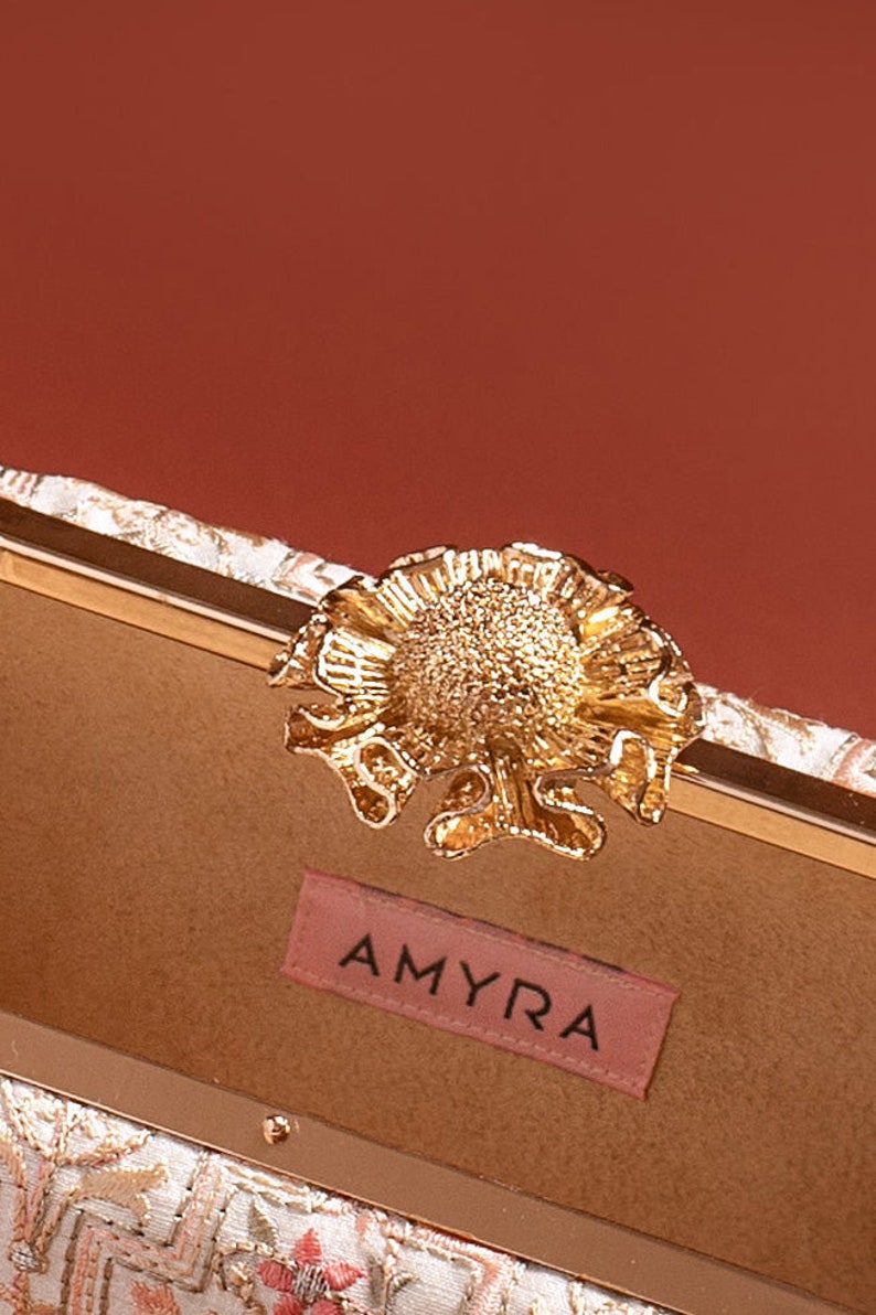 AMYRA Mogra Capsule Clutch