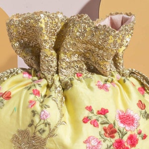 Reet floral embroidered potli - pastel yellow