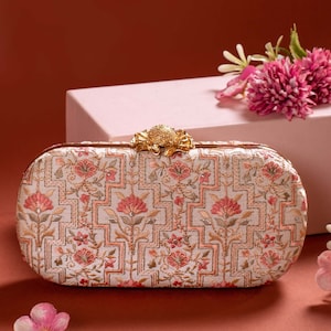 AMYRA Mogra Capsule Clutch