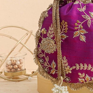 Purple embroidered scallop potli bag