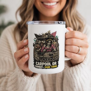 May include: White travel mug with a humorous graphic of a zombie driving a car filled with other zombies. The text on the mug reads "CARPOOL OR COMBAT - SAME THING". The mug has a silver rim and a white handle.