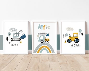 May include: Three framed prints with construction vehicle illustrations. The prints feature a blue excavator, a crane truck, and a yellow tractor. Each print has a white border and is set against a white background. The excavator print says "Beep!"