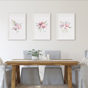 A set of three framed watercolor floral prints featuring pink and purple peonies with green leaves arranged in a minimalistic and elegant style against a white background. Pink peonies set of three prints, floral print set of 3, pink green botanical bouquet art, large poster, bathroom art hallway art, wall art