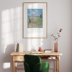 Scripture print trio with Claude Monet paintings and Psalms, displayed above modern wooden floor