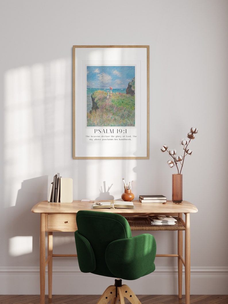 Scripture print trio with Claude Monet paintings and Psalms, displayed above modern wooden floor