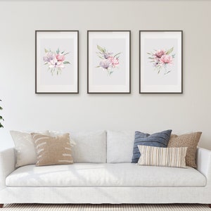 A set of three framed watercolor floral prints featuring pink and purple peonies with green leaves arranged in a minimalistic and elegant style against a white background. Pink peonies set of three prints, floral print set of 3, pink green botanical bouquet art, large poster, bathroom art hallway art, wall art