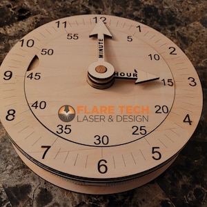 Peut inclure: Un minuteur en bois avec une aiguille des minutes et une aiguille des heures. Le minuteur est marqu&eacute; de nombres de 1 &agrave; 12 et de 5 &agrave; 60. Le minuteur est fabriqu&eacute; par Flare Tech Laser & Design.