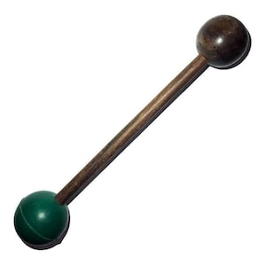 May include: A wooden stick with a green rubber ball on one end and a brown wooden ball on the other end.