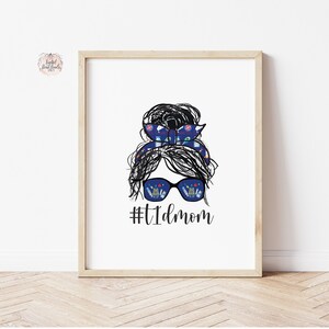 May include: A black and white illustration of a woman with a messy bun and sunglasses. The sunglasses have a pattern of medical supplies inside. The text #TIDmom is below the illustration.