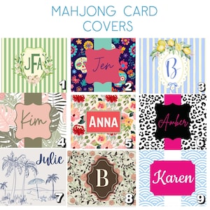 May include: Nine Mahjong card covers with diverse designs. The covers display names such as "JFA", "Jen", "B", "Kim", "Anna", "Amber", "Julie", "B", and "Karen". The designs incorporate floral patterns, stripes, and a beach scene.