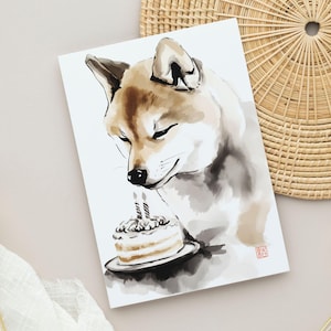 Carte d'anniversaire Shiba-Inu imprimable - Art sumi-e japonais minimaliste avec un chien mignon regardant un gâteau, parfaite pour les amoureux des chiens et les fans du Japon