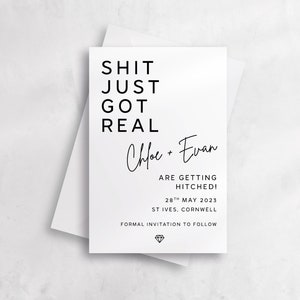 May include: A white wedding announcement card with black text that reads "Shit Just Got Real" followed by the names "Chloe + Evan" and the date "28th May 2023".