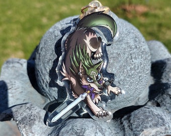 May include: A clear acrylic keychain featuring a cartoon wolf character with green fur, a purple collar, and a sword. The wolf is holding the sword in its mouth and has a determined expression on its face.