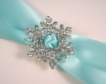 5 snöflingor med strassspänne