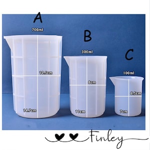 May include: Three clear silicone measuring cups with graduated markings. The largest cup is 700 ml and measures 14.7 cm in diameter and 10.5 cm in height. The middle cup is 300 ml and measures 11 cm in diameter and 8 cm in height. The smallest cup is 100 ml and measures 7 cm in diameter and 6.5 cm in height.