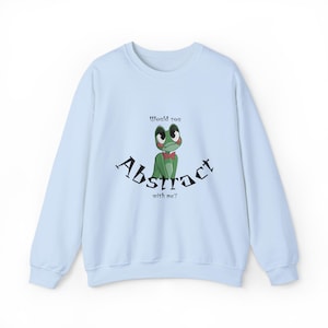 May include: Light blue sweatshirt with a cartoon frog graphic. The frog has large eyes and a red bow tie. The text "Would you Abstract with me?" is arched around the frog.